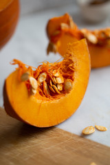 pumpkins with cinnamon sticks on marble backgrund