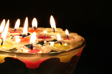 Indian candles floating on a bowl of water on the occasion of Diwali, Indian festival of lights.