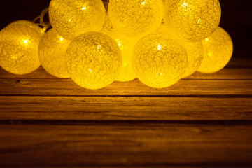 Christmas rustic background. Vintage planked wood with Christmas lights ball shaped