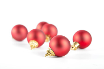 Red small christmas balls isolated on white background