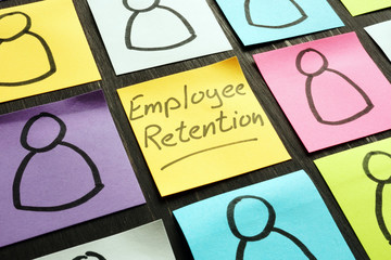 Employee retention sign and figurines on the memo sticks.