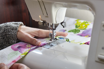 Tailoring Process - Women's hands behind her sewing