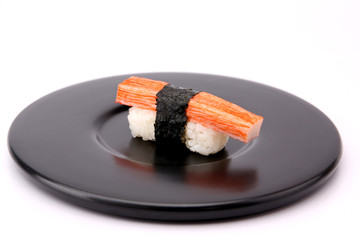 Sushi Crab Sticks with a Black Plate on a White Background