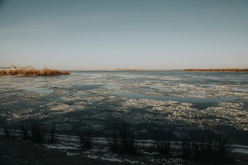 Obraz premium Ice o the river in spring. Flood concept. Volga river in Astrakhan concept. 