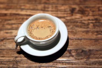 espresso on brown wood