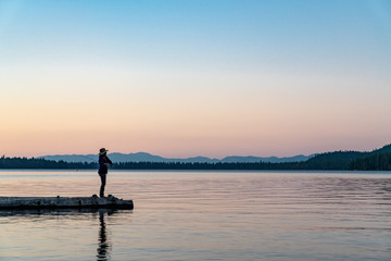 Woman Fishing in Lake Tahoe During Sunset