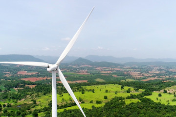Wind turbine is alternative electrical power with blue sky, summer field, renewable energy