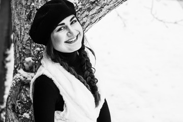 Fototapeta premium Happy arabic woman at Christmas Holiday having fun at winter snowy day, concept of positive mood