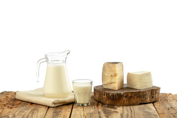 Different milk products, cheese, cream, milk on wooden table and white background. Healthy eating and lifestyle, organic natural nutrition, diet. Delicious food and drinks.