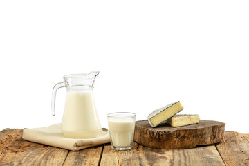 Different milk products, cheese, cream, milk on wooden table and white background. Healthy eating and lifestyle, organic natural nutrition, diet. Delicious food and drinks.