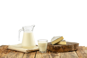 Different milk products, cheese, cream, milk on wooden table and white background. Healthy eating and lifestyle, organic natural nutrition, diet. Delicious food and drinks.