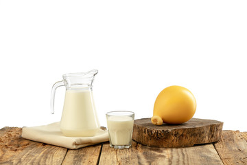 Different milk products, cheese, cream, milk on wooden table and white background. Healthy eating and lifestyle, organic natural nutrition, diet. Delicious food and drinks.