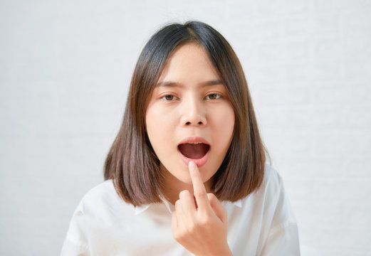 Asian Woman Gorgeous Charming And Touch Mouth With Hand.