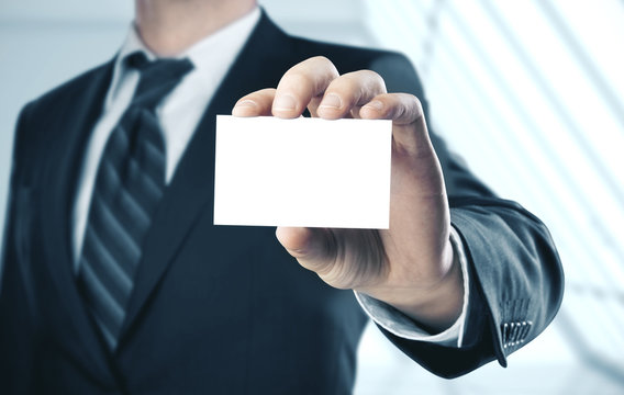 Businessman Holding A Blank Business Card