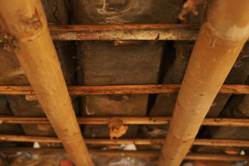 Exposed bamboo and roof tile ceiling