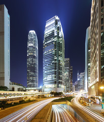 Modern office buildings in Central Hong Kong at night with traffic