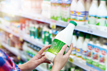 Woman with milk in store