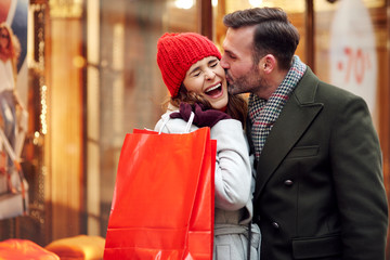 Romantic scene during Christmas shopping