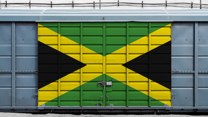 Front view of a container train freight car with a large metal lock with the national flag of...