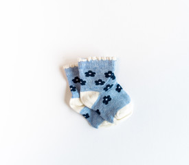 Blue baby socks isolated on white background 