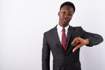 Young handsome African businessman wearing suit against white ba