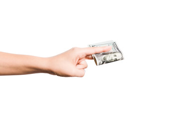 Female hand giving a bundle of dollar bills on white isolated background. Power and wealth concept