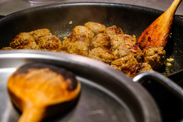 Making Swedish meatballs.