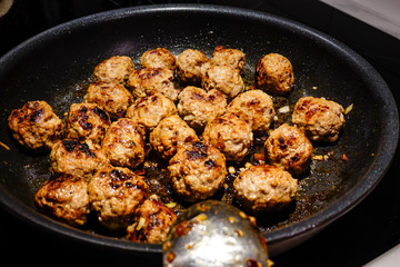 Making Swedish meatballs.