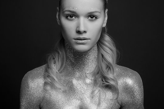 Silver Blond Girl. Beautiful Young Woman with Sparkles