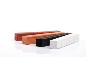 Artist pastels on white background with reflection