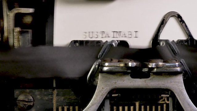 Typing Climate Change words on a vintage typewriter