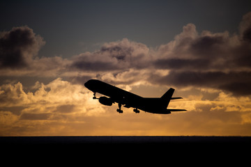 Airliner take off in the evening sun.