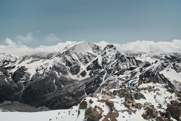 snow-capped mountains on the background of clouds