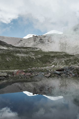 mountain and fog in the reflection of the lake