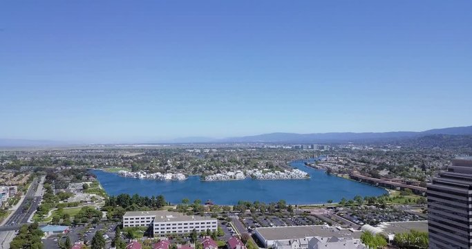 aerial panoramic water front view of bungalow residential houses in foster city near Visa Global HQ on hills dale blvd drone fly forward