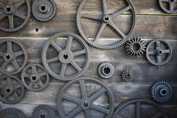 Wooden wall with gears or cogwheel