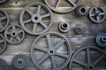 Wooden wall with gears or cogwheel