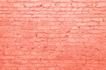 Coral pink toned brick wall background texture