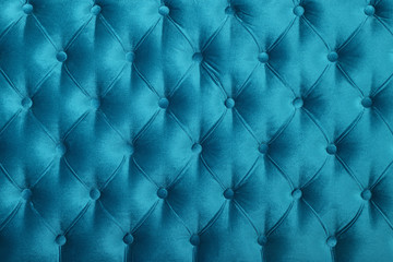 Teal blue capitone tufted fabric upholstery texture