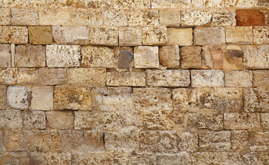 Wall of white limestone bricks blocks