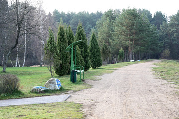 Fototapeta premium Photo of the river, water pier. Autumn park on the shore. Image of nature, forest, landscape.