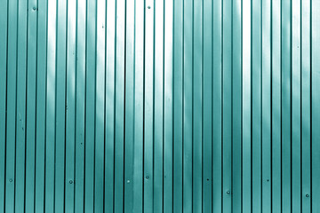 Metal list wall texture of fence in cyan color.