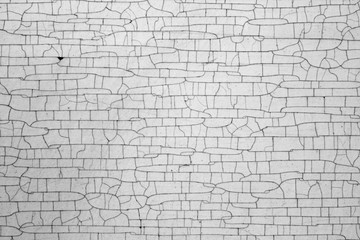 Cracks on metal texture in black and white.