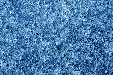 Fototapeta na wymiar Frost on car glass texture in navy blue tone.