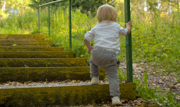 Toddler Climbing Up Stairs