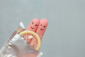 Fingers art of Happy couple. Concept of safe sex.