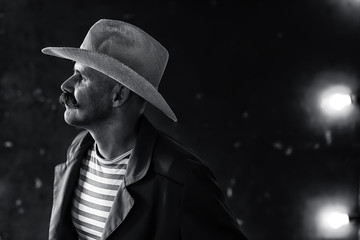 stylized vintage portrait of a man wild west, mustachioed dangerous criminal, mustache on his face