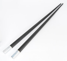 Two black and plastic Chinese chopsticks