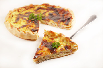 quiche and slice isolated on white background