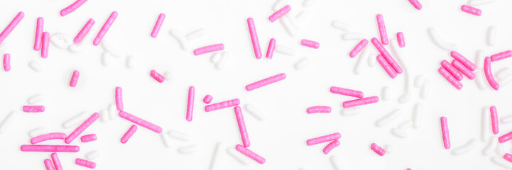 Banner, white and pink sugar sprinkles on white background